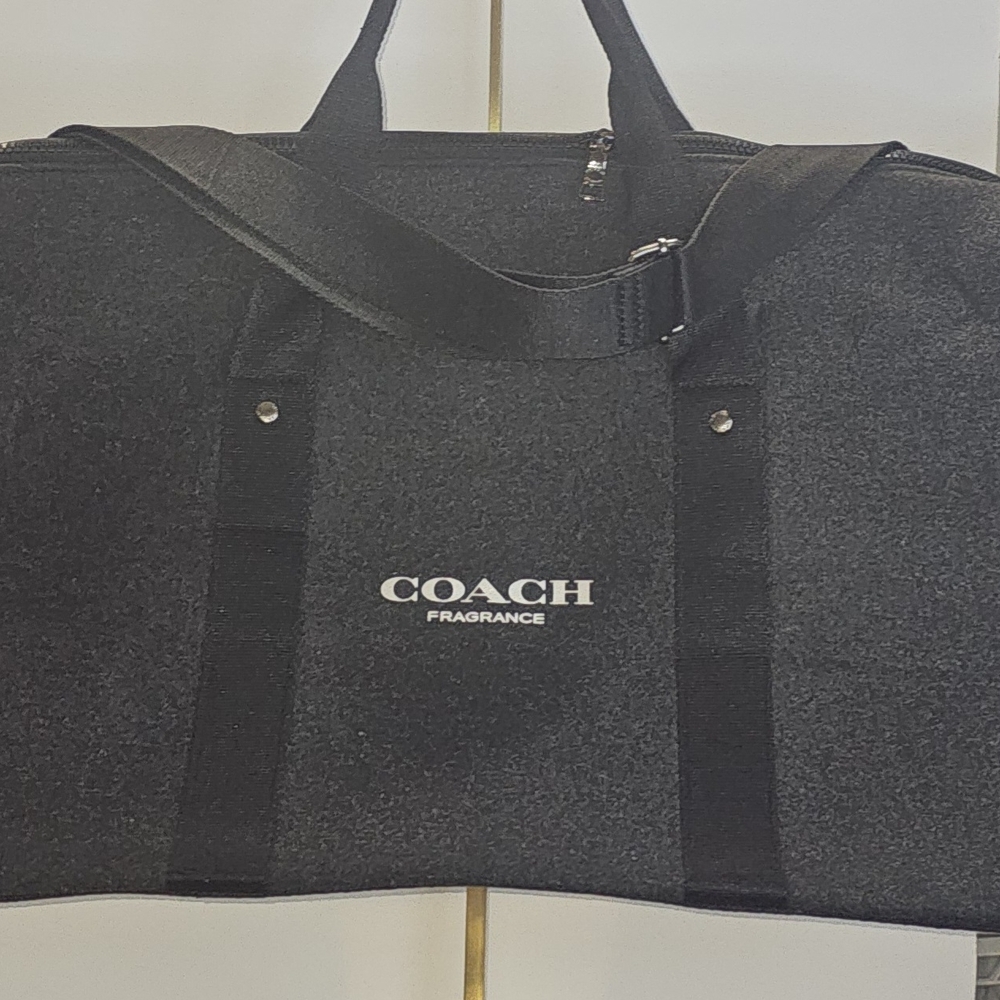 This NWT Coach Fragrance duffle bag ,Is versatile, unisex Travel/ Gym-Dark Grey